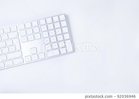 White and silver modern keyboard on white background. Copy space 92036946