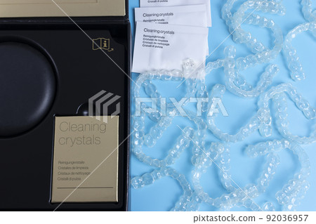 Invisalign transparent braces or brackets package box on blue background 92036957