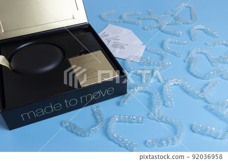 Invisalign transparent braces or brackets package box on blue background 92036958