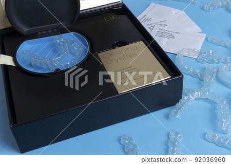Invisalign transparent braces or brackets package box on blue background 92036960