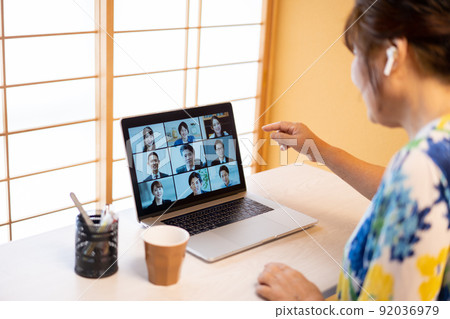 Woman having an online meeting with remote work 92036979