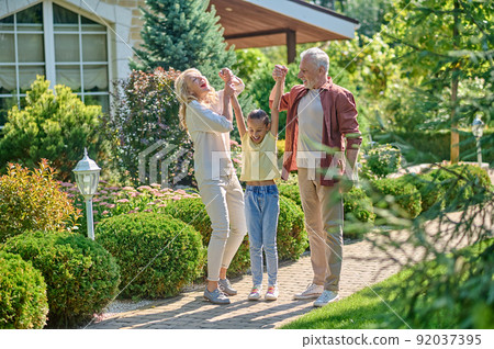 Family having fun together and looking enjoyed 92037395