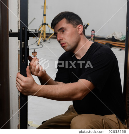 The technique of installing a door lock in an interior door. 92038266