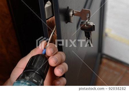 Installation of lock and door handle to interior doors, locksmith works with doors. 92038282