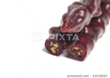 National caucasian dessert churchkhela isolated on a white background. National caucasian dessert churchkhela isolated on a white background. 92038697