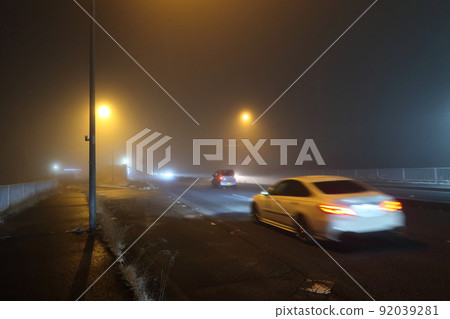 National road where night fog occurred 92039281