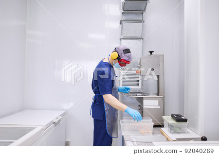 A researcher works with materials for experiments 92040289