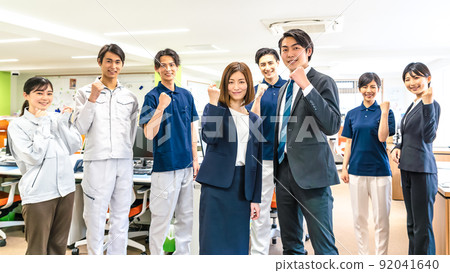 Staff doing guts pose 92041640