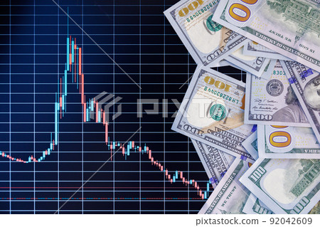 US dollar banknote stacks over digital screen with exchange chart, depreciation and volatility concept, directly above view US dollar banknote stacks over digital screen with exchange chart, depreciation and volatility concept, directly above view 92042609