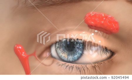 A drop of the saline, watery fluid continually secreted by the lacrimal glands 92045494