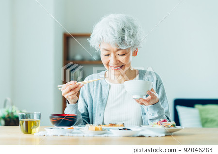 Senior woman eating 92046283