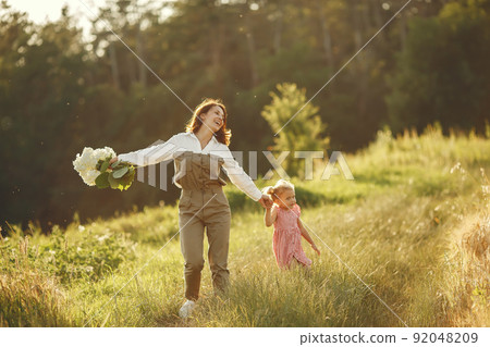 Family in a summer field. Sensual photo. Cute little girl. Family in a summer field. Sensual photo. Cute little girl. 92048209