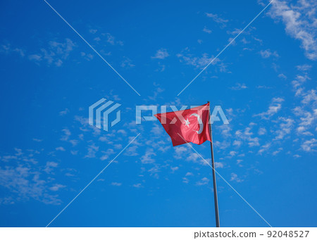 Waving Turkish Flag with blue sky Waving Turkish Flag with blue sky 92048527