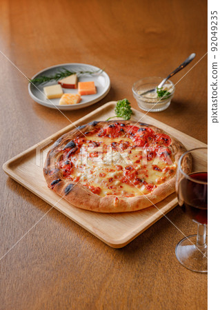 Authentic pizza and red wine baked in a stone oven 92049235