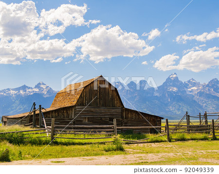 Sunny view of the John Moulton Barn and Teton Range 92049339