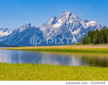 Sunny view of the Teton mountain range of Grand Teton National Park 92049409