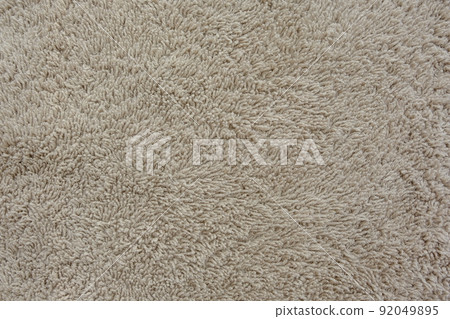 Fluffy gentle pastel biege fabric with waves and folds. Soft pastel textile texture. 92049895