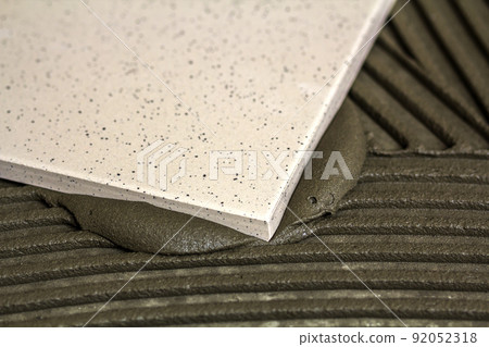 Ceramic tiles and tools for tiler. Floor tiles installation. Home improvement, renovation - ceramic tile floor adhesive, Ceramic tiles and tools for tiler. Floor tiles installation. Home improvement, renovation - ceramic tile floor adhesive, 92052318