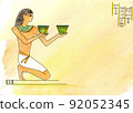 An Egyptian man with a glass in his hand, an Egyptian drinking wine.  92052345