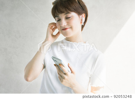 Young woman earphones Young woman earphones 92053248