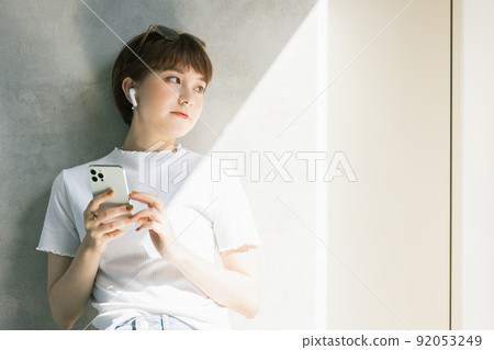 Young woman earphones 92053249