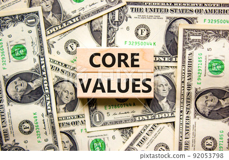 Core values symbol. Concept words Core values on wooden blocks on a beautiful background from dollar bills. Business value and core values concept, copy space. Core values symbol. Concept words Core values on wooden blocks on a beautiful background from dollar bills. Business value and core values concept, copy space. 92053798