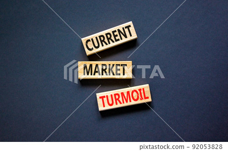 Current market turmoil symbol. Concept words Current market turmoil on wooden blocks on a beautiful black table black background. Business, finacial current market turmoil concept. Copy space. 92053828