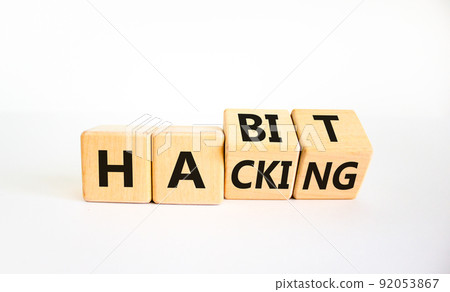 Habit hacking symbol. Turned wooden cubes with words 'Habit hacking'. Beautiful white table, white background. Psychology, habit hacking concept. Copy space. 92053867