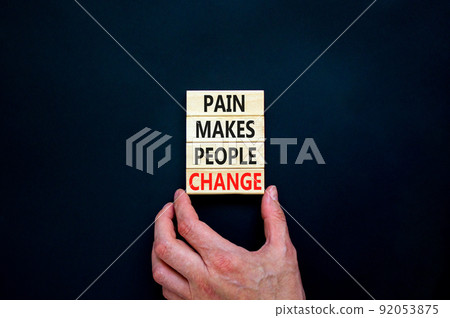 Pain makes people change symbol. Concept words Pain makes people change on wooden blocks on a beautiful black table black background. Business, motivational and pain makes people change concept. Pain makes people change symbol. Concept words Pain makes people change on wooden blocks on a beautiful black table black background. Business, motivational and pain makes people change concept. 92053875