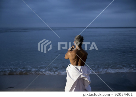 Male senior Japanese kendo wielding a bamboo sword Male senior Japanese kendo wielding a bamboo sword 92054401