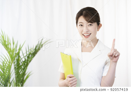 Esthetician smiling with a file 92057419