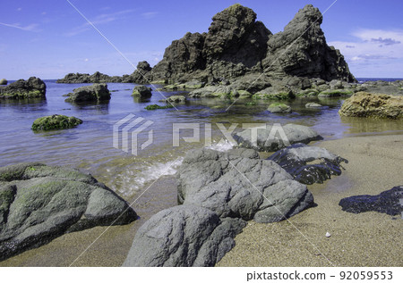 Calm coast and reefs on a sunny day Calm coast and reefs on a sunny day 92059553