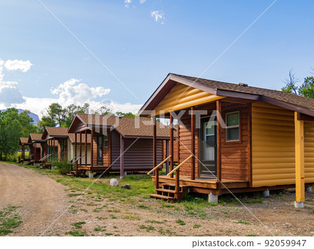 Sunny view of beautiful wooden house 92059947