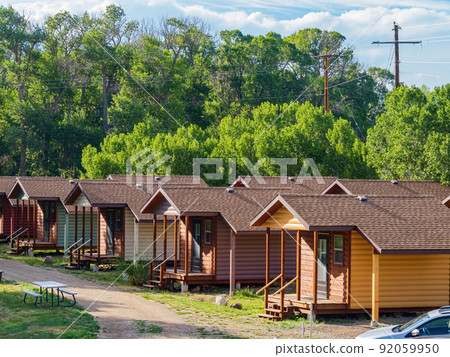 Sunny view of beautiful wooden house 92059950