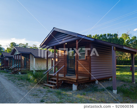 Sunny view of beautiful wooden house 92060036