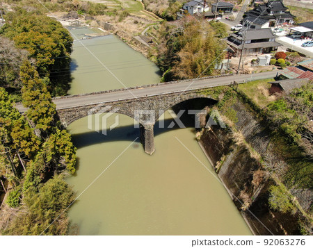Aerial view of Mitsuhashi, the longest stone bridge in Usa City Aerial view of Mitsuhashi, the longest stone bridge in Usa City 92063276