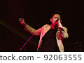 Asian male singer showing his performance on stage 92063555