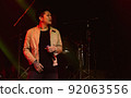 Asian male singer showing his performance on stage 92063556