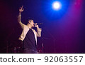 Asian male singer showing his performance on stage 92063557
