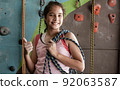 Portrait of girl holding robe for rock climbing 92063587