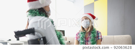 Visit friend in hospital room, relative in wheelchair, face mask for protection 92063628