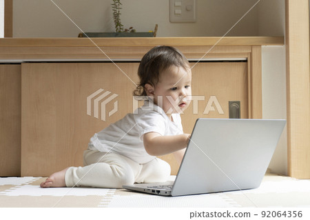 Half boy touching the screen of the PC Half boy touching the screen of the PC 92064356