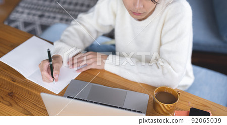 Young man studying computer Young man studying computer 92065039