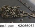 Close up of a bunch of chains on a vintage box 92066062