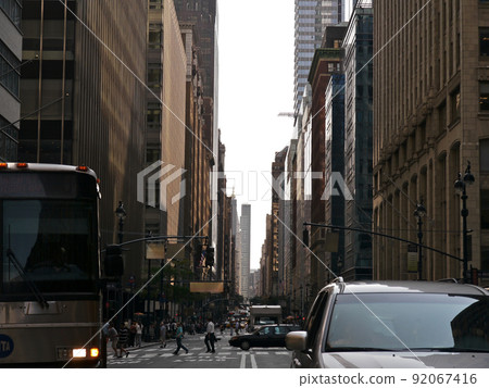 Madison Avenue, Manhattan, New York. A street that stretches straight through the valley of high-rise buildings. Madison Avenue, Manhattan, New York. A street that stretches straight through the valley of high-rise buildings. 92067416
