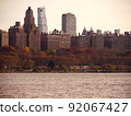 Buildings in Manhattan, New York at dusk over the Hudson River. 92067427