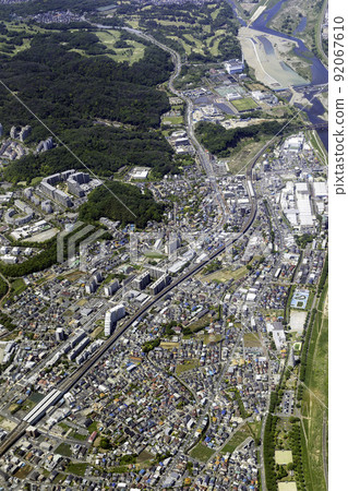 Aerial view from the sky above Inagi Naganuma Station on the Nambu Line toward Minamitama Station 92067610