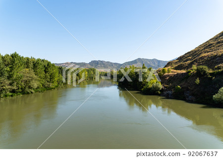 Ebro River in Haro, La Rioja, sunny day of summer Ebro River in Haro, La Rioja, sunny day of summer 92067637