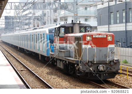 DE10 type diesel locomotive towed Seibu 40000 series A class transport train passing through Maya Station on the Tokaido Main Line 92068821