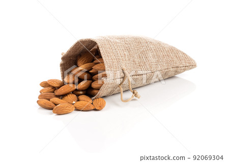 Almonds on a white background Almonds on a white background 92069304